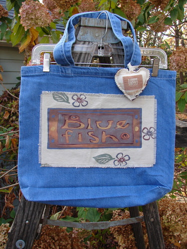 2001 PMU Patched Tote Bag Summer Frayed Logo Washed Denim One Size, featuring a puffy heart accent and vintage patches, showcasing sustainable design with tote-length straps and gusset bottom.