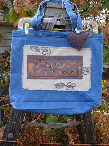 2001 PMU Patched Tote Bag Summer Frayed Logo Washed Denim One Size featuring a puffy heart accent, tote-length shoulder straps, and a gusset bottom, embodying vintage-inspired sustainable design from Bluefishfinder.com.