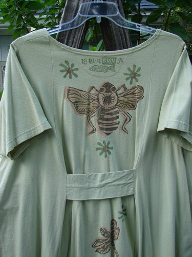 1994 Leaf Top Music Garden Aloe Size 2 featuring a bee drawing on the front, unique painted 4-point hemline, and reverse inserted triangular neckline, showcasing Blue Fish Clothing's vintage creativity.