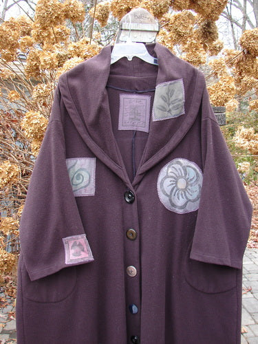 1994 Patched Wool Falling Snow Coat with multi-colored patches, oversized cape-like design, and shawl collar.