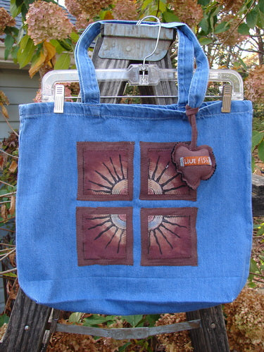 1998 PMU Patched Tote Bag Fall Quad Washed Denim One Size featuring a colorful puffy heart accent, metal lock detail, and tote-length shoulder straps, celebrating sustainable vintage design from Bluefishfinder.com.