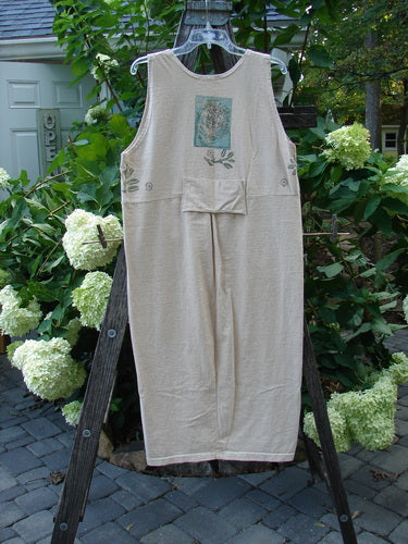 1995 Tab Jumper Magic Forest Natural Altered OSFA displayed on a rack, showcasing its extreme scoop neckline, tapered lower, drop waist seam with a tiny pocket, and painted tab for a stylish fit.