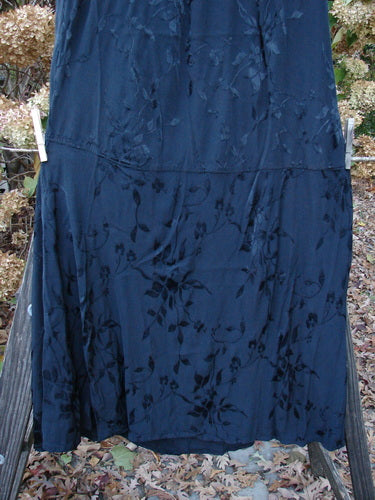 Barclay Brocade Willow Skirt Unpainted Black Size 2: A beautiful skirt with trailing floral pattern, full elastic waistline, and unique paneled lower. Perfect for layering or as a standalone piece.