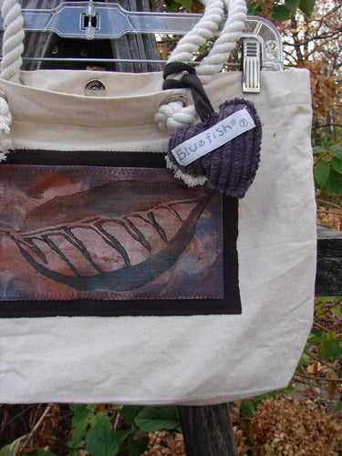 1998 PMU Patched Canvas Rope Pocket Tote Bag Ash Leaf Natural One Size with purple heart tag, showcasing Blue Fish Patch, cotton rope straps, and interior zip pocket, embodying sustainable vintage style from Bluefishfinder.com.