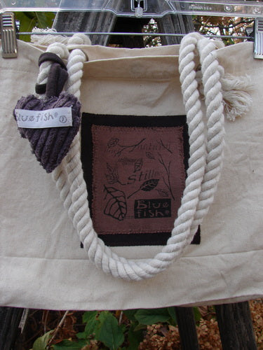 1998 PMU Patched Canvas Rope Pocket Tote Bag Ash Leaf Natural One Size, featuring a heart-shaped ornament and rope accents, highlighting Bluefishfinder.com's commitment to sustainable, vintage-inspired designs.