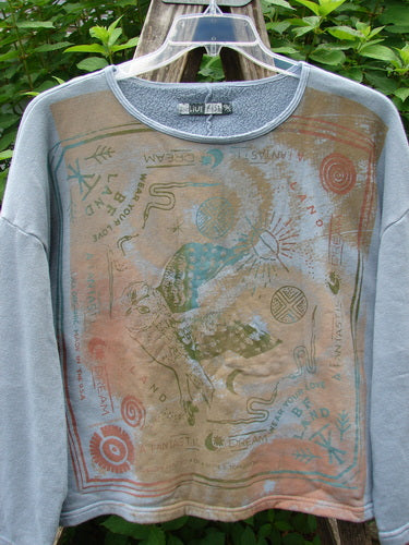 Barclay Fleece Crop Boxy Sweatshirt with a Blue Fish Land theme, featuring a wide, slightly A-lined shape, drop shoulders, and long wide sleeves, displayed on a hanger against a neutral background.