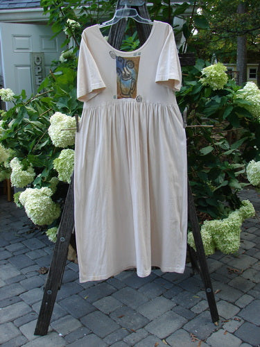 1996 Simple Dress Magic Teacup Birch Bark Size 0 on a wooden ladder, showcasing its empire waist seam, full sweeping skirt, and signature blue fish stamp in outdoor setting.