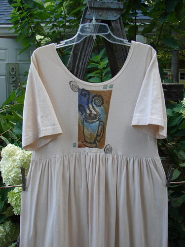 1996 Simple Dress Magic Teacup Birch Bark Size 0: White short-sleeved dress with a drawing of a coffee cup on the front, featuring a slightly deeper neckline and a drop empire waist seam.