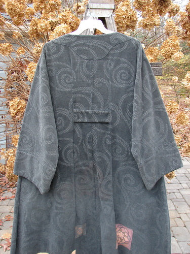 2000 Patched Upholstery Diwmach Coat Swirl Black Size 2: A grey coat on a swinger, featuring a damask swirl pattern, vintage buttons, and belled sleeves.