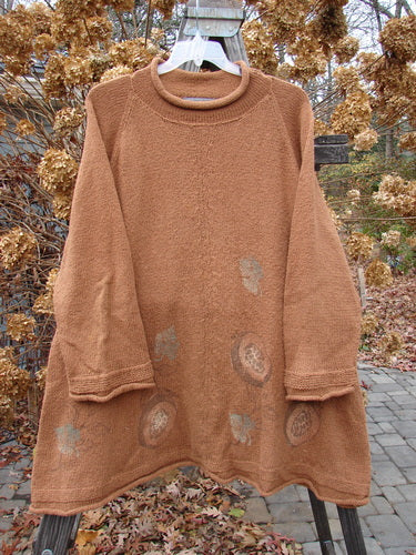 1998 Rocky Mountain Raglan Sweater featuring a brown sweater with a scarf on a swinger from the Holiday Winter Resort Collection.