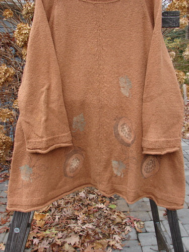 1998 Rocky Mountain Raglan Sweater featuring a brown patterned knit, loose mock turtleneck, and contrasting sleeve accents.