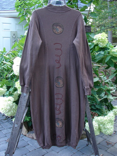 1996 Thermal Day Dress Celestial Molasses Size 0 displayed on a wooden ladder, showcasing figure-eight curvy stitchery, thicker ribbed cuffs, and celestial-themed paint.