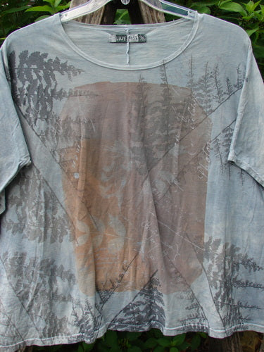 Barclay Cricket Cap Sleeve Tee Pine Forest Blue Dawn OSFA features a seamless shoulder sleeve and a tree design, showcasing a unique boxy shape with a hip flare.