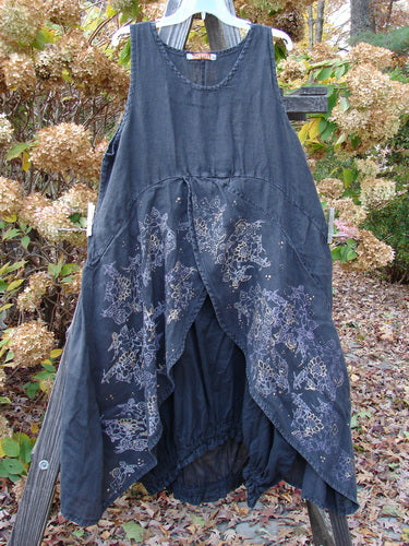 Barclay Linen Open Front Drawcord Hem Jumper Metallic Floral Black Size 1: A blue dress with a long ruffle and floral design.