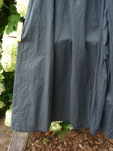 Barclay Batiste Crop Wide Leg Pant in unpainted black, size 2, with a loose cropped silhouette and wide legs in textured woven fabric. The dark garment hangs vertically, showing soft folds, a matte finish, and a clean hem.