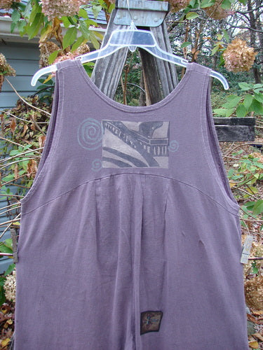 The 1993 PMU Patched Wide Pant Overall Jumper Travel Dusty Plum Size 1 displayed on a hanger, showcasing its unique vintage style with wide legs and distinct patches.