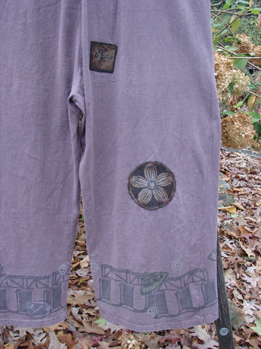 1993 PMU Patched Wide Pant Overall Jumper Travel Dusty Plum Size 1, featuring wide belled legs and unique flower patches, showcases vintage Blue Fish style with artistic travel-themed designs and front buttons.