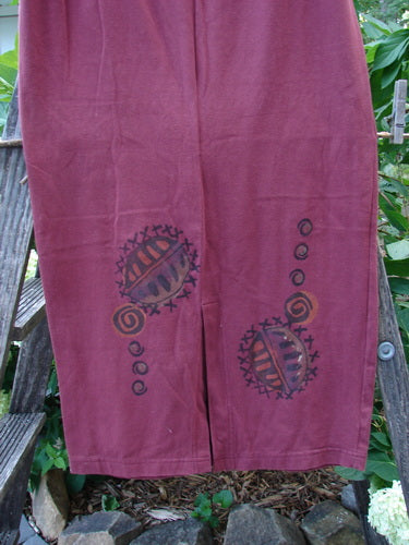 1996 Cotton Lycra Column Skirt River Rock Cayenne Size 1, featuring artistic hand-painted patterns, a tapered pegged hemline, and a back kick vent, with a full elastic waistline for a slimming fit.