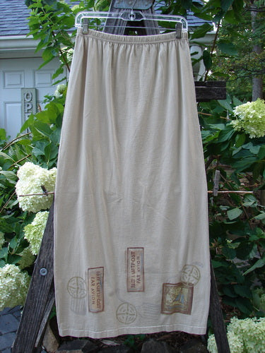 1998 Straight Skirt Airmail Quill Size 0 hanging on a clothesline, showcasing its full elastic waistband, slightly longer straight shape, and Airmail travel-themed hem. Made from mid-weight organic cotton.