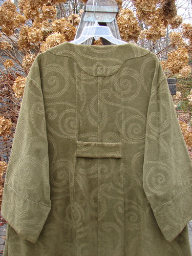 2000 Patched Upholstery Diwmach Coat Swirl Pine Size 2: A stunning green coat with swirls, vintage buttons, and belled sleeves.