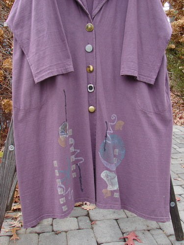 1994 Carriage Coat in Fugi Purple, OSFA: A billowy collar can be worn as a scarf or shawl. Oversized vintage buttons, deep side pockets, and an Asian fan theme add unique style. Bust 60, Waist 64, Hips 70. Lengths: Front 44, Back 44, Sides 47.