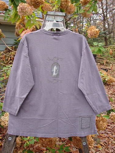 Long-sleeved tee titled '1999 Long Sleeved Tee Candle Blackberry Size 1' displayed on a swinger, highlighting its vintage Blue Fish Clothing style.