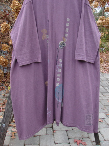 1994 Carriage Coat Asian Fan Fugi Purple OSFA: A purple robe with a big wide billowy collar and oversized vintage buttons. Features include a huge hem circumference, deep side pockets, and a varying hemline.