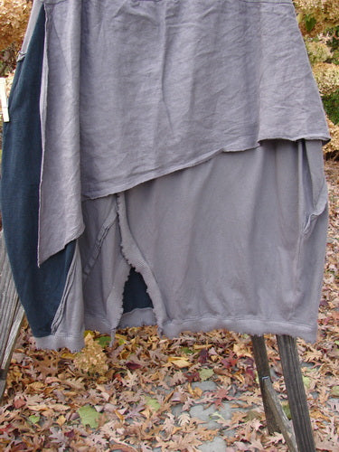 Barclay Mixed Media Swatch Skirt on clothesline, showcasing layered upper, sectional panels, and full elastic waistline.