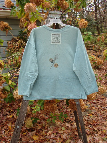 1993 Long Sleeved Tee Medallian Field Ocean OSFA displayed on a mannequin, featuring intricate leaf and plant designs, epitomizing the unique, vintage style offered by Bluefishfinder.com.