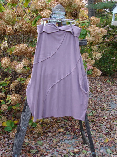Barclay Cotton Lycra Fold Over Lantern Skirt, Plum Stripe, Size 2. Graduating bell shape with S-shaped stitchery. Tap edgings and deep drop side pocket.