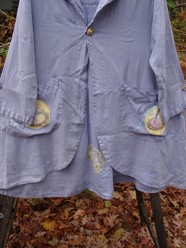 1999 Breeze Jacket Flower Heart Iris OSFA, featuring a sailor collar, oversized front pockets, and a flowing hemline, captured in a close-up highlighting its unique handkerchief linen texture and painted design elements.