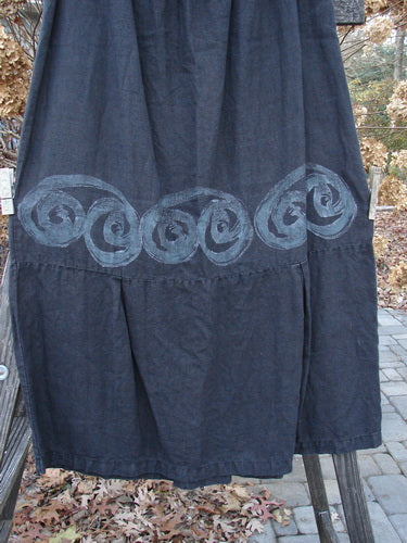 2000 Pages Market Duo Celtic Black Size 2: A skirt with a design on it, made from hemp summer cloth. Features include a laced front and sleeve, side vents, varying hemline, large front pockets with Celtic paint and bottom fringe.