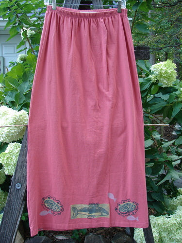 1996 Straight Skirt River Fish Oriole Size 0, displayed hanging on a clothesline, showcasing its organic cotton fabric, full elastic waistband, and slight A-line shape without pockets.