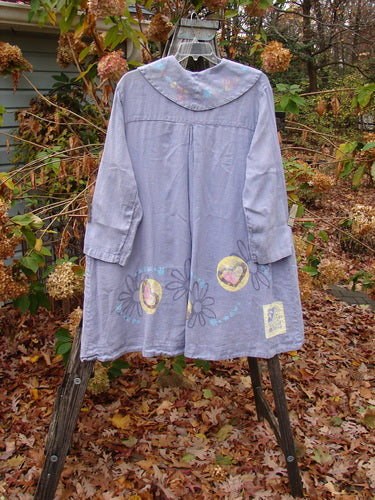 1999 Breeze Jacket Flower Heart Iris OSFA displayed on a rack, showcasing its floral and heart theme paint, oversized drop pockets, and painted sailor collar, embodying BlueFishFinder's vintage, creative fashion style.