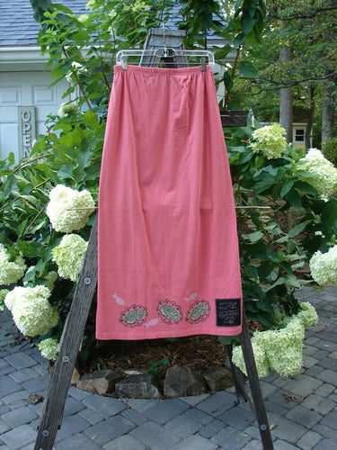 1996 Straight Skirt River Fish Oriole Size 0 displayed draped on a wooden ladder, showcasing its full elastic waistband and slightly A-line shape, with no visible pockets.