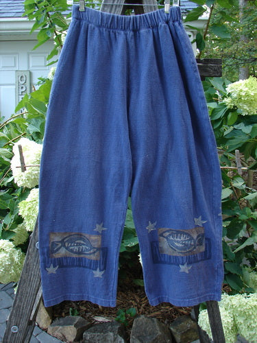 1995 Reprocessed Fitzgerald Pant Fish Star Royal Orchid Altered Size 1, featuring blue pants with fish designs, elastic waist, and side pockets, made from dense reprocessed cotton for a cozy, vintage feel.