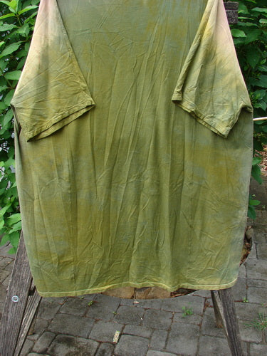 Close-up of the Barclay Art Tee Primitive Path Mottled Fall Festival OSFA, showcasing its tunic length, drop shoulders, loose three-quarter sleeves, and unique hemline, embodying Bluefishfinder.com's creative, vintage style.