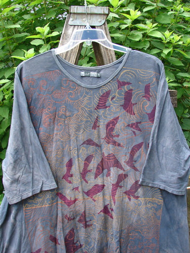 Barclay Tournesol Tunic Gull Flock Mottled Night Sky OSFA, featuring a bird pattern, drop shoulders, loose three-quarter sleeves, and a varying hemline, exemplifies Blue Fish Clothing's vintage-inspired, creative freedom ethos.