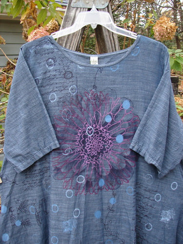 Barclay Woven Short Sleeved Pullover Tunic Mum Cross Dye Navy Size 1 features a delicate purple flower design on lightweight cotton, embodying vintage charm and creative expression from BlueFishFinder.com.