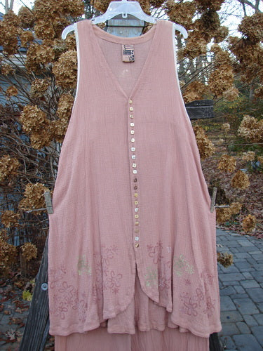 1998 Gauze Shell Layering Duo Tiny Floral Blush Size 2: A pink dress on a clothesline, featuring tiny sweet square shell buttons, hand-dyed silk ribbon edges, and a rounded hemline.