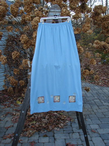 Image alt text: "1997 Elements Dock Straight Duo Shells Atlantis Size 2: Blue skirt with sea life designs on a rack"