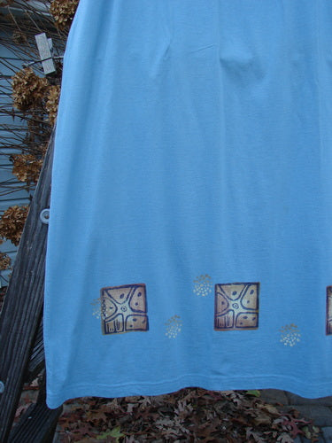 Image alt text: 1997 Elements Dock Straight Duo Shells Atlantis Size 2 blue fabric with gold designs, featuring a close-up of a wheel and a square.