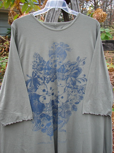 Barclay Three Quarter Sleeved Cafe Tunic Pansy Light Moss Size 2 featuring a grey base adorned with blue floral patterns, offering medium weight and a close-up view of the intricate design and sleeve detail.