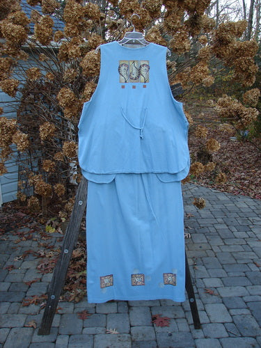 1997 Elements Dock Straight Duo Shells Atlantis Size 2: Blue shirt and skirt on wood stand. Organic cotton. Dock vest with single button closure, signature patch, high vented rounded sides, drawcord back, and triple shell theme paint. Straight skirt with elastic waistband and sea life theme. Bust 52, waist 54, hips 60, length 30. Waist fully relaxed 28, waist fully extended 48, hips 48, length 39. Vintage Blue Fish Clothing.