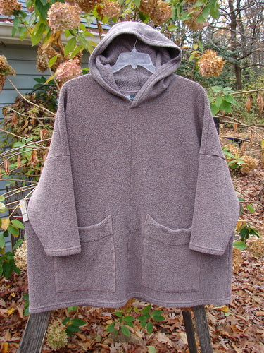 Barclay Fleece Hooded Square Pocket Pullover Unpainted Variegated Stone OSFA hangs on a clothesline, showcasing its cozy, heavy-weight organic cotton and recycled poly construction with visible pockets, aligning with Bluefishfinder.com's vintage aesthetic.