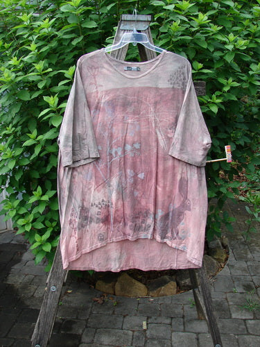 Barclay Tournesol Tunic Bunny Field Mottled Mauve OSFA displayed on a swing, showcasing its tunic length, loose three-quarter sleeves, and rounded neckline, embodying Bluefishfinder.com's vintage creative style.