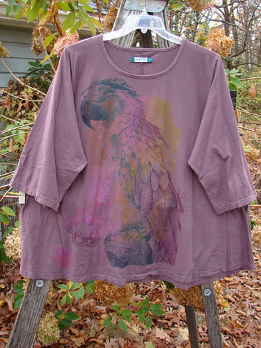 Barclay Three Quarter Sleeved Cafe Top Parrot Burgundy Size 2 features a purple garment with a parrot design, exemplifying BlueFishFinder's vintage, creative style from Jennifer Barclay's iconic Blue Fish Clothing line.