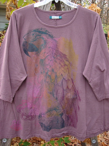 Barclay Three Quarter Sleeved Cafe Top Parrot Burgundy Size 2 features a parrot motif on a purple shirt, exemplifying the vintage, creative style of Bluefishfinder.com’s unique clothing line.