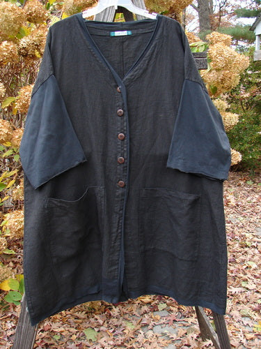 Barclay Cotton Sleeve Pocket Cardigan on rack, with unique design elements.