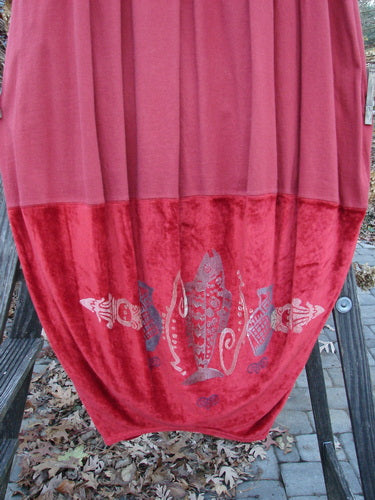 Image alt text: 1996 Velvet Arrowhead Sofia Duo Pomegranate Size 1: Red and pink towel on a wooden stand, matching blanket, and curtain with fish and shopping cart.